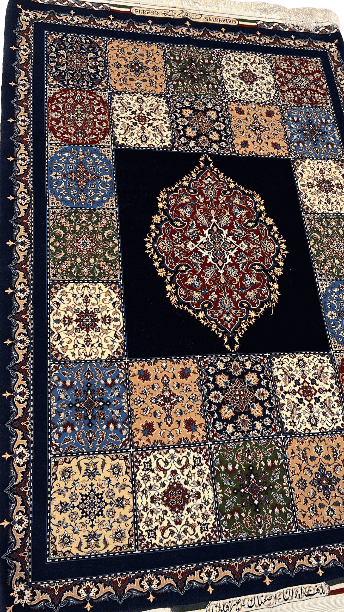 "Close-up of the intricate floral and geometric patterns on a Farzad Seirafian Persian rug, highlighting the fine knotting and vibrant colors."